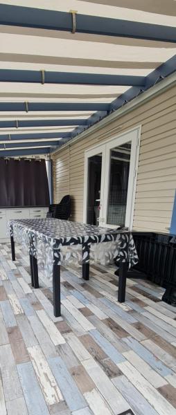 Mobil home neuf 693 à la réserve 8 personnes avec terrasse couverte